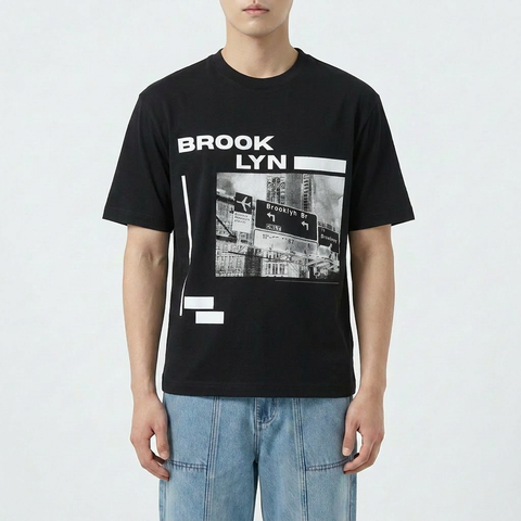A male model wearing the Smith's 1906 MTE05B Black T-Shirt with Brooklyn Graphic is showing the front.