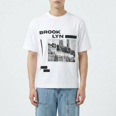 A male model wearing the Smith's 1906 MTE05B White T-Shirt with Brooklyn Graphic is showing the front.