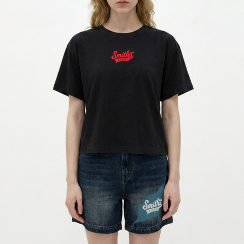 A female model wearing the Smith's 1906 WTE03 Black T-shirt is showing the front.