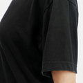 A female model wearing the Smith's 1906 WTE03 Black T-shirt is showing the side view.