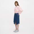 A female model is wearing a hoodie paired with the Smith's 1906 WSK01 Blue Denim Skirt.