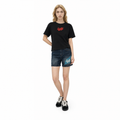 A female model is wearing shorts paired with the Smith's 1906 WTE03 Black T-shirt.